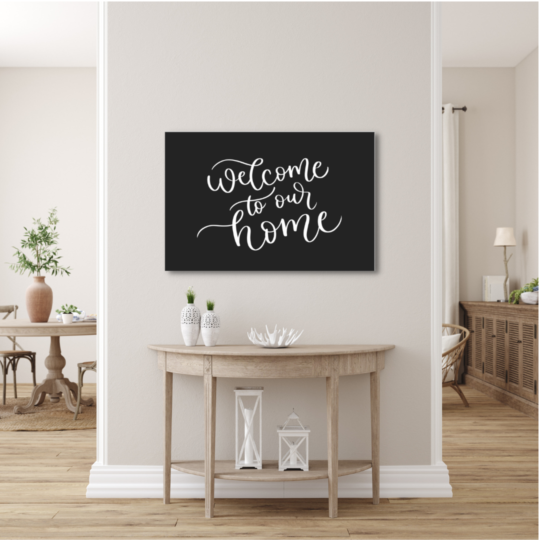 Welcome To Our Home Black Canvas Sign