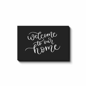 Welcome To Our Home Black Canvas Sign